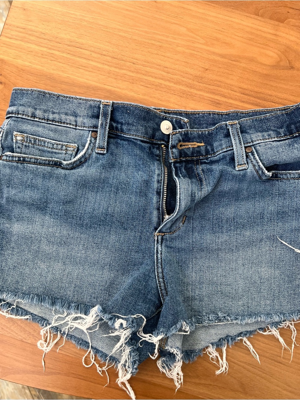 Joe’s Ozzie 4” Frayed Hem Mid-Blue Denim Shorts.